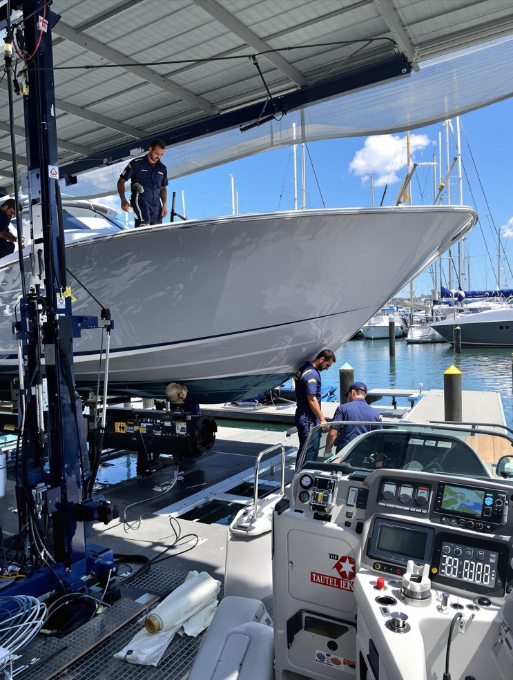 Boat repair and maintenance crew working on a dock