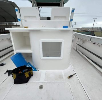 Boat Repair Near Me technicians working on a center console boat repair project.