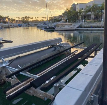 A newly serviced dock and boat lift at sunset, maintained by Boat Repair Near Me.