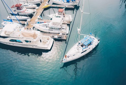 white-boat-leaving-the-marina-docks-sailing-on-the-2025-02-07-22-44-47-utc-min